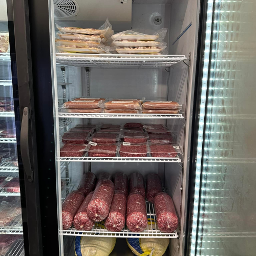 Inside Hamilton Farm & Ranches convenience meat fridge overview