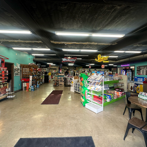 Inside Hamilton Farm & Ranches convenience aisle overview