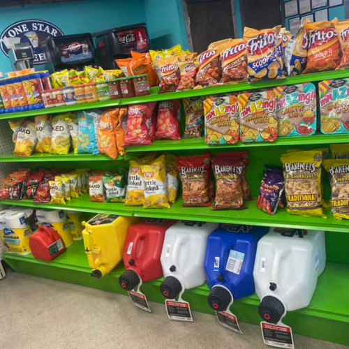 Inside Hamilton Farm & Ranches convenience snack aisle overview