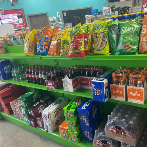 Inside Hamilton Farm & Ranches convenience snack aisle overview