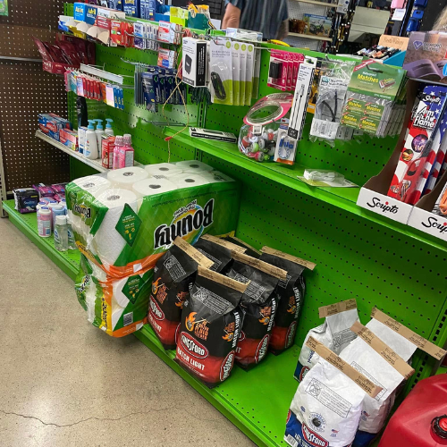 Inside Hamilton Farm & Ranches convenience snack aisle overview