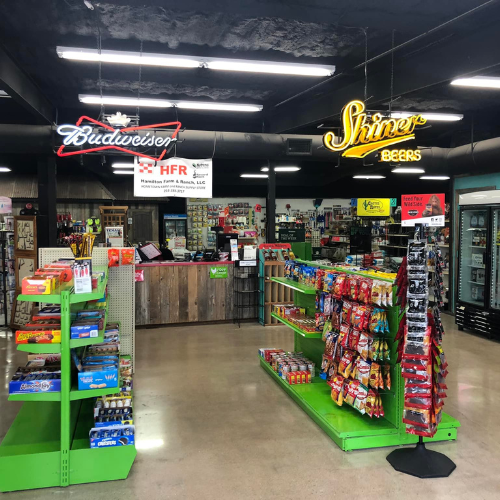 Inside Hamilton Farm & Ranches convenience aisle overview