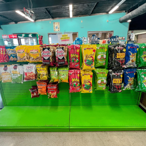 Inside Hamilton Farm & Ranches convenience snack aisle overview