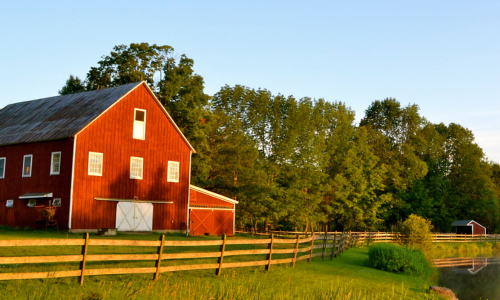 A red barn at sunset